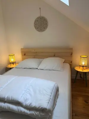 Un ou plusieurs lits dans un hébergement de l'établissement Appartement Le Dôme-Vue sur les montagnes