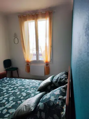 Un ou plusieurs lits dans un hébergement de l'établissement Pierre du Lac - Maison Aydat