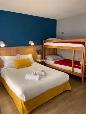 Un ou plusieurs lits dans un hébergement de l'établissement Auberge des Trois Rivières