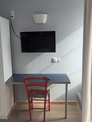 Télévision ou salle de divertissement dans l'établissement Auberge des Trois Rivières