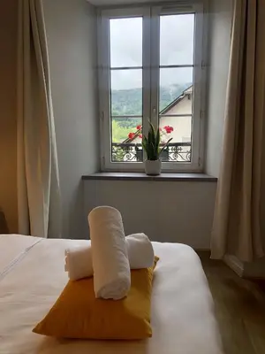 Un ou plusieurs lits dans un hébergement de l'établissement Auberge des Trois Rivières
