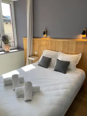 Un ou plusieurs lits dans un hébergement de l'établissement Auberge des Trois Rivières