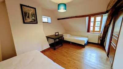 Un ou plusieurs lits dans un hébergement de l'établissement Maison des bois