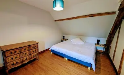 Un ou plusieurs lits dans un hébergement de l'établissement Maison des bois