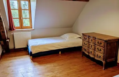 Un ou plusieurs lits dans un hébergement de l'établissement Maison des bois