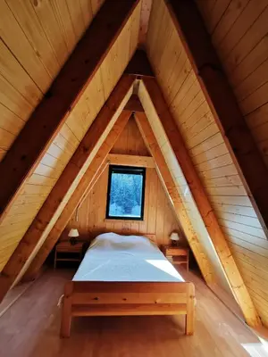Un ou plusieurs lits dans un hébergement de l'établissement Chalet du Lioran