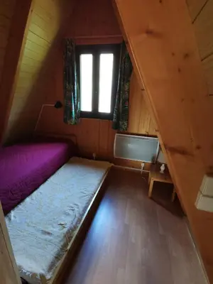 Un ou plusieurs lits dans un hébergement de l'établissement Chalet du Lioran