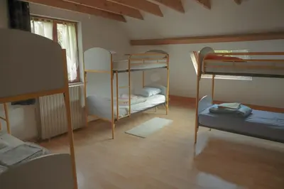 Un ou plusieurs lits dans un hébergement de l'établissement Gite de la grande maison