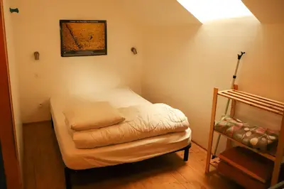 Un ou plusieurs lits dans un hébergement de l'établissement Gite de la grande maison