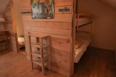 Un ou plusieurs lits dans un hébergement de l'établissement Gite de la grande maison