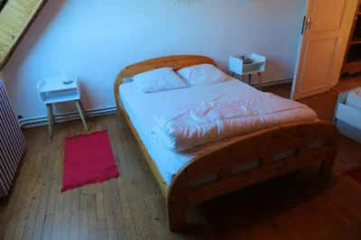 Un ou plusieurs lits dans un hébergement de l'établissement Gite de la grande maison