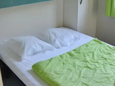 Un ou plusieurs lits dans un hébergement de l'établissement Chalet avec Terrasse - 2 Chambres - 5 Pers. - API-1-52-1233