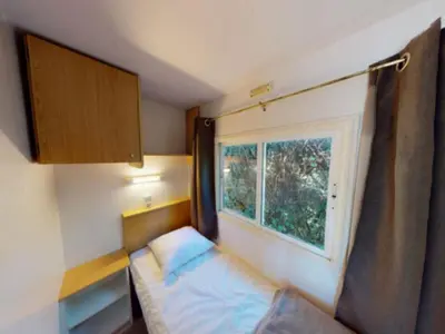 Un ou plusieurs lits dans un hébergement de l'établissement Mobil-home cosy 5 pers avec terrasse - API-1-52-1240