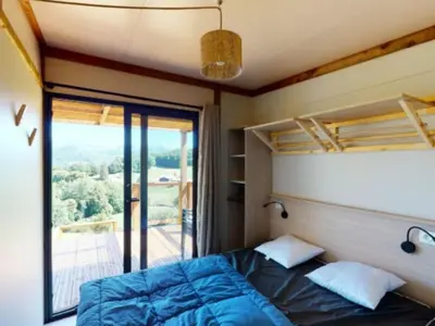 Un ou plusieurs lits dans un hébergement de l'établissement Chalet cosy de 6 personnes avec terrasse à Vic-sur-Cère - API-1-52-1255