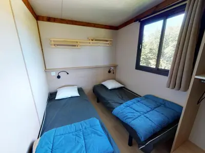 Un ou plusieurs lits dans un hébergement de l'établissement Chalet cosy de 6 personnes avec terrasse à Vic-sur-Cère - API-1-52-1255