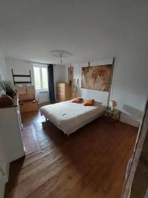 Un ou plusieurs lits dans un hébergement de l'établissement Maison spacieuse