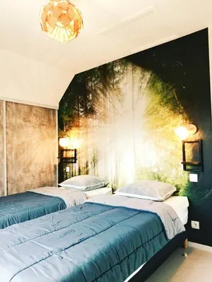 Un ou plusieurs lits dans un hébergement de l'établissement Cottage 4 étoiles nature en Auvergne by Cantal Emotions CH