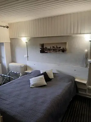 Un ou plusieurs lits dans un hébergement de l'établissement Hôtel les Platanes