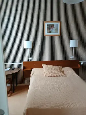 Un ou plusieurs lits dans un hébergement de l'établissement Hôtel les Platanes