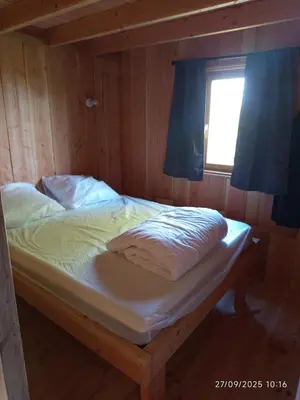 Un ou plusieurs lits dans un hébergement de l'établissement Chalet au coeur de la Corrèze