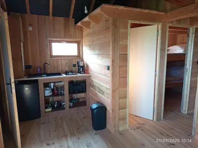 Cuisine ou kitchenette dans l'établissement Chalet au coeur de la Corrèze