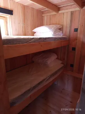 Un ou plusieurs lits dans un hébergement de l'établissement Chalet au coeur de la Corrèze
