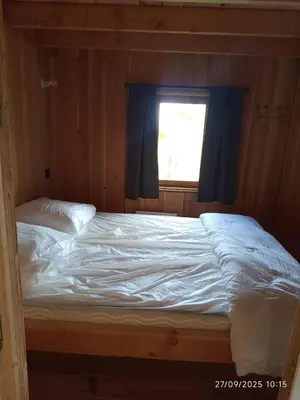 Un ou plusieurs lits dans un hébergement de l'établissement Chalet au coeur de la Corrèze