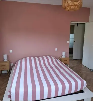 Un ou plusieurs lits dans un hébergement de l'établissement Appartement Magnolias