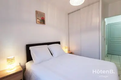Un ou plusieurs lits dans un hébergement de l'établissement Balcons de Renoir Parking & piscine - Limoges