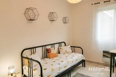 Un ou plusieurs lits dans un hébergement de l'établissement Balcons de Renoir Parking & piscine - Limoges