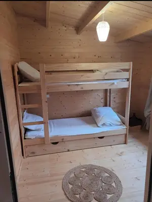 Un ou plusieurs lits dans un hébergement de l'établissement Chalet des étangs