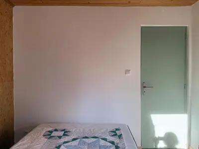 Un ou plusieurs lits dans un hébergement de l'établissement Chalet dans la nature