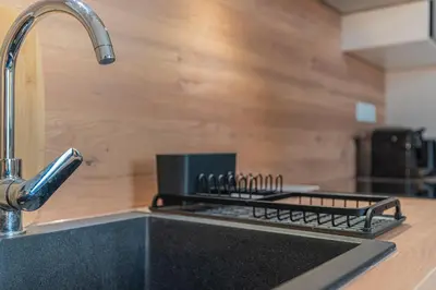 Cuisine ou kitchenette dans l'établissement Le Chic, central et cozy