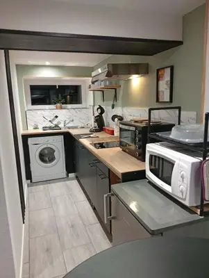 Cuisine ou kitchenette dans l'établissement L'harmonie des Oiseaux
