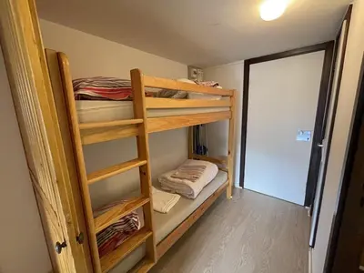 Un ou plusieurs lits dans un hébergement de l'établissement Studio Cosy avec Balcon au 2e Étage, Le Lioran - FR-1-787-147