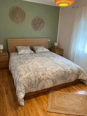 Un ou plusieurs lits dans un hébergement de l'établissement Maison de bourg au coeur du parc des volcans d'Auvergne