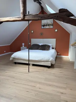 Un ou plusieurs lits dans un hébergement de l'établissement Logement 3 chambres Montignac