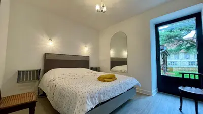 Un ou plusieurs lits dans un hébergement de l'établissement Maison périgourdine avec jardin à 10 min de Sarlat