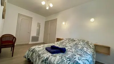 Un ou plusieurs lits dans un hébergement de l'établissement Maison périgourdine avec jardin à 10 min de Sarlat