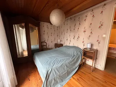Un ou plusieurs lits dans un hébergement de l'établissement La petite maison de la place