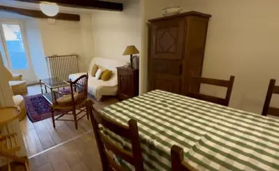 Un ou plusieurs lits dans un hébergement de l'établissement La petite maison de la place