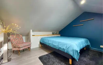 Un ou plusieurs lits dans un hébergement de l'établissement Charmante Maison Avec Piscine