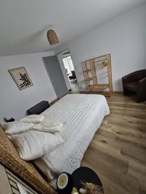 Un ou plusieurs lits dans un hébergement de l'établissement Maison Cosy tout confort, 3 min Clinique et autoroute