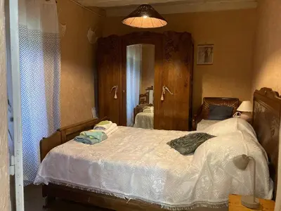 Un ou plusieurs lits dans un hébergement de l'établissement Maison de campagne Chez Tata Yoyo