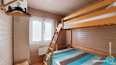 Un ou plusieurs lits dans un hébergement de l'établissement Chalet de la Gougère 3