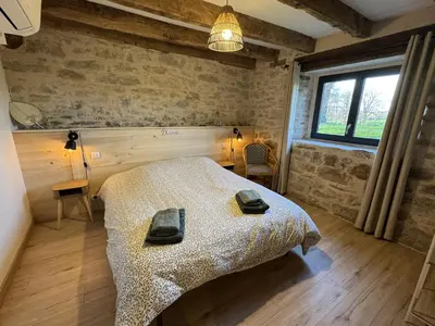 Un ou plusieurs lits dans un hébergement de l'établissement La grange