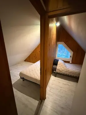Un ou plusieurs lits dans un hébergement de l'établissement LK gîte la forêt