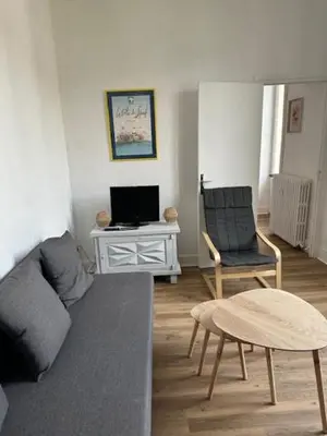Coin salon dans l'établissement Appartement 16 Colette