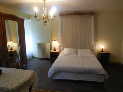 Un ou plusieurs lits dans un hébergement de l'établissement Homestay Château De Saint-Maixant