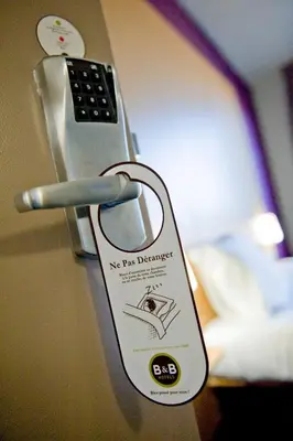 Un ou plusieurs lits dans un hébergement de l'établissement B&B HOTEL Limoges 1
